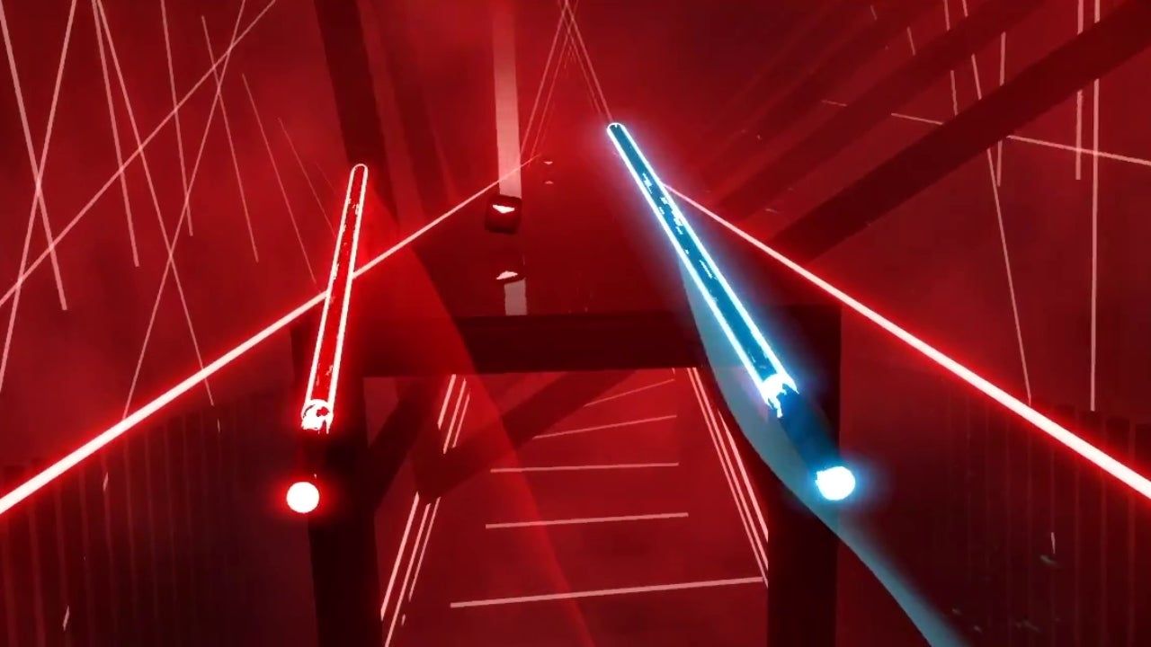 A screenshot from the VR game, Beat Saber. It's from a first person point of view and shows two light sabers, one red one blue and then many other lights in the surrounding environment.  